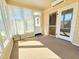 Bright sunroom filled with natural light, carpet floors and multiple windows, ideal for relaxation at 117 Woodcroft Drive Dr, Angier, NC 27501
