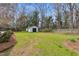 Spacious backyard with a shed and a fenced perimeter, providing ample space for outdoor activities and storage at 1192 Princeton Kenly Rd, Kenly, NC 27542