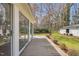 Wooden deck with access to a sunroom, providing a seamless indoor-outdoor transition to the backyard at 1192 Princeton Kenly Rd, Kenly, NC 27542