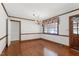 Bright dining room with wood floors, large window, and elegant chandelier at 1192 Princeton Kenly Rd, Kenly, NC 27542