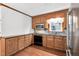 A well-equipped kitchen featuring wood cabinets, black appliances, and granite countertops at 1192 Princeton Kenly Rd, Kenly, NC 27542