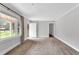 Spacious living room offering natural light and carpeted floors, creating an inviting atmosphere at 1192 Princeton Kenly Rd, Kenly, NC 27542