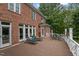 Spacious deck features lounge chairs and dining table overlooking a landscaped yard at 12012 Six Forks Rd, Raleigh, NC 27614