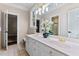 Elegant bathroom featuring double sinks, ample counter space, and modern fixtures at 12012 Six Forks Rd, Raleigh, NC 27614
