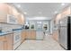 Eat-in kitchen area featuring tile floors, ample counter space, and modern appliances at 12012 Six Forks Rd, Raleigh, NC 27614