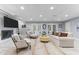 Cozy living room with a fireplace, built-in bookshelves, and comfortable seating at 12012 Six Forks Rd, Raleigh, NC 27614