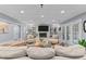 A spacious living room offers a cozy fireplace, built-in shelving and recessed lighting at 12012 Six Forks Rd, Raleigh, NC 27614