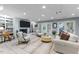 Cozy living room with a fireplace, built-in bookshelves, and comfortable seating at 12012 Six Forks Rd, Raleigh, NC 27614