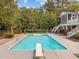 Backyard swimming pool with diving board and easy access to patio and landscaped yard at 12012 Six Forks Rd, Raleigh, NC 27614