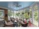 Cozy screened-in porch with comfortable seating and an inviting atmosphere for relaxation at 12012 Six Forks Rd, Raleigh, NC 27614