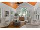 Cozy sitting room with vaulted wood ceiling features comfortable seating, and lots of natural light at 12012 Six Forks Rd, Raleigh, NC 27614