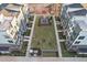 Aerial view of a well-maintained community with open green spaces and modern townhouses at 1218 Coach Station Alley # 101, Raleigh, NC 27601