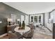 Comfortable living room featuring modern decor, large windows, and stylish furnishings at 1218 Coach Station Alley # 101, Raleigh, NC 27601
