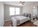 Bright bedroom with natural light, hardwood floors, and a large mirror, creating a cozy and stylish atmosphere at 1301 Clarendon St, Durham, NC 27705