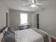 Cozy bedroom features a ceiling fan and a bright window for natural light at 1301 Clarendon St, Durham, NC 27705