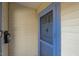 Close-up of the front entrance with a blue-trimmed screen door at 1301 Clarendon St, Durham, NC 27705