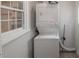 Efficient laundry area featuring a stacked washer and dryer for space-saving convenience at 1301 Clarendon St, Durham, NC 27705