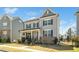 Well-maintained home with a quaint front porch and inviting curb appeal at 1516 Barn Door Dr, Apex, NC 27502
