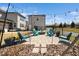 Enjoy outdoor gatherings around this backyard fire pit area with comfortable seating and charming string lights at 1516 Barn Door Dr, Apex, NC 27502