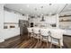 Contemporary kitchen with a large island, stylish pendant lighting, and ample counter space at 1516 Barn Door Dr, Apex, NC 27502