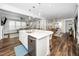Spacious kitchen featuring an island with seating, connecting to the living and dining areas at 1516 Barn Door Dr, Apex, NC 27502