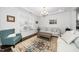 Bright living room with a large window, hardwood floors, and cozy seating at 1516 Barn Door Dr, Apex, NC 27502