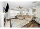 Bright living room featuring fireplace, neutral decor, and abundant natural light at 1516 Barn Door Dr, Apex, NC 27502