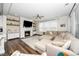 Cozy living room with fireplace, large sectional sofa, and plenty of natural light at 1516 Barn Door Dr, Apex, NC 27502