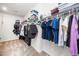 A walk-in closet with lots of shelving and hanging space for clothes and accessories at 1516 Barn Door Dr, Apex, NC 27502