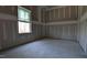 Unfinished bedroom featuring a window and unfinished floors at 1791 Pecan Drive # 22, Nashville, NC 27856