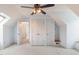 A bedroom featuring neutral walls, a ceiling fan, and double closets with light carpeting at 205 Fox Hollow Dr, Clayton, NC 27527