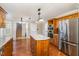 Bright kitchen with a granite island, stainless steel appliances, and ample storage space at 205 Fox Hollow Dr, Clayton, NC 27527