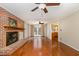 Spacious living room features a brick fireplace, wood floors, and ample natural light at 205 Fox Hollow Dr, Clayton, NC 27527