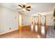 Bright living room with wood floors, a ceiling fan, and lots of natural light at 205 Fox Hollow Dr, Clayton, NC 27527