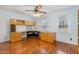 Office with hardwood flooring, built-in shelving, and two windows with neutral walls at 205 Fox Hollow Dr, Clayton, NC 27527