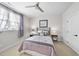 This bedroom features a bed with grey accents, a side table with a lamp and a ceiling fan at 2244 Plowridge Rd, Fuquay Varina, NC 27526