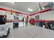 Well-organized garage space with epoxy flooring, storage cabinets, and tool chests at 2244 Plowridge Rd, Fuquay Varina, NC 27526