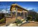 Outdoor gazebo with charming details like fairy lights, swing, fan, and comfortable seating to enjoy the wooded view at 2244 Plowridge Rd, Fuquay Varina, NC 27526