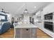 Well-appointed kitchen with white cabinetry and integrated appliances at 2244 Plowridge Rd, Fuquay Varina, NC 27526