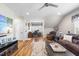 Cozy living room with hardwood floors, comfortable seating, and a ceiling fan at 2244 Plowridge Rd, Fuquay Varina, NC 27526