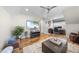 Cozy living room with hardwood floors, comfortable seating, and a ceiling fan at 2244 Plowridge Rd, Fuquay Varina, NC 27526