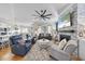 Spacious living room features fireplace, hardwood floors, and ample seating at 2244 Plowridge Rd, Fuquay Varina, NC 27526