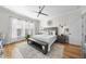Inviting main bedroom features hardwood floors, ceiling fan, and natural light at 2244 Plowridge Rd, Fuquay Varina, NC 27526