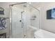 Glass enclosed shower with bench and tiled walls at 2244 Plowridge Rd, Fuquay Varina, NC 27526