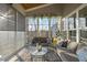 Sunroom features many windows, comfortable seating, wood ceiling, and carpeted floor at 2244 Plowridge Rd, Fuquay Varina, NC 27526