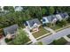 An aerial view of the charming two story home, featuring mature trees, a well maintained lawn and ample parking at 229 Shillings Chase Dr, Cary, NC 27518
