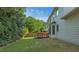 A well-maintained lawn with a wood deck provides outdoor living space at 229 Shillings Chase Dr, Cary, NC 27518