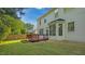 A manicured lawn and spacious wood deck provide a great space for outdoor entertaining at 229 Shillings Chase Dr, Cary, NC 27518