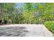 Well-maintained outdoor basketball court surrounded by trees and fencing at 229 Shillings Chase Dr, Cary, NC 27518