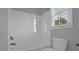 This bathroom is well-lit and features a combination tub and shower at 229 Shillings Chase Dr, Cary, NC 27518
